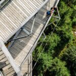 skywalk allgäu - Aerial shot of a wooden walkway nestled in a lush forest at Dolní Morava, Czech Rep