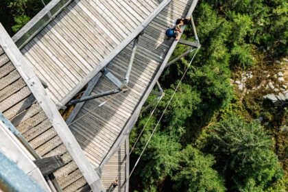 skywalk allgäu - Aerial shot of a wooden walkway nestled in a lush forest at Dolní Morava, Czech Rep