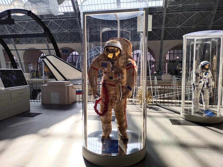 universum bremen - Historic space suits showcased in a museum with ample natural light.