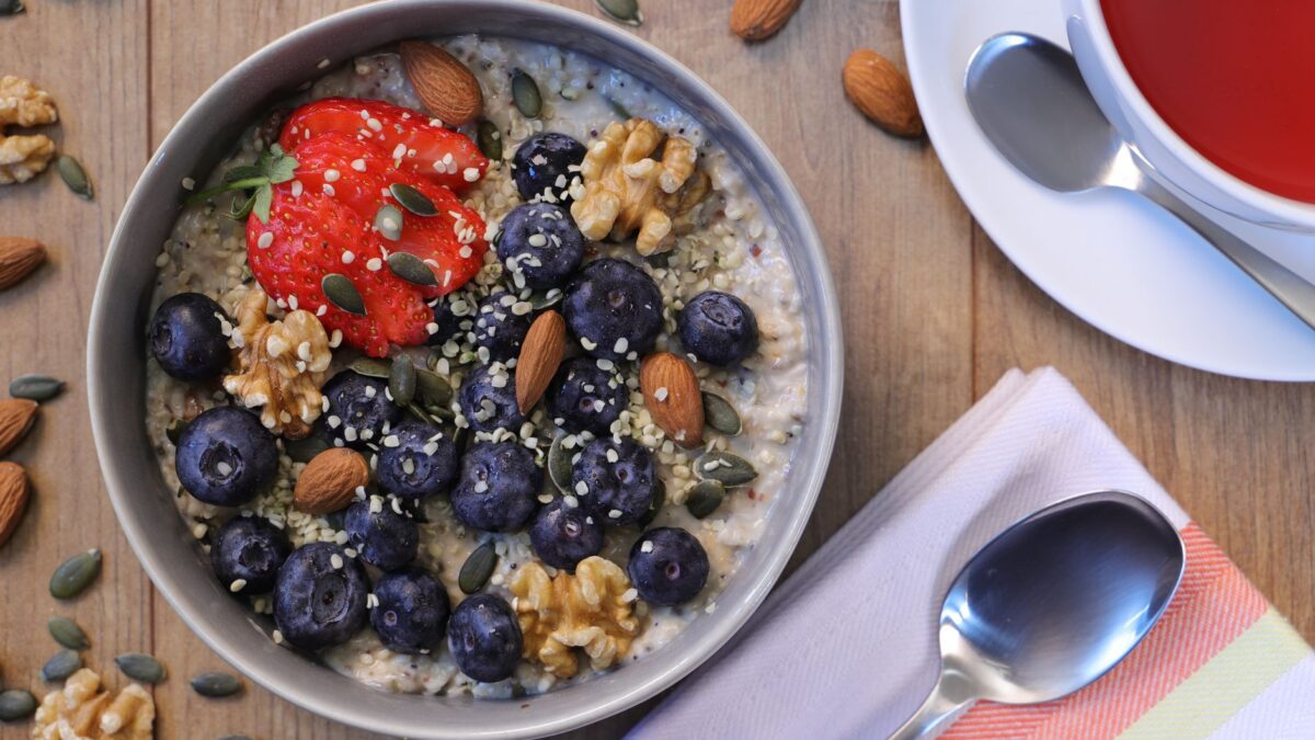 A nutritious breakfast bowl featuring strawberries, blueberries, almonds, and walnuts. Ideal for a healthy start.